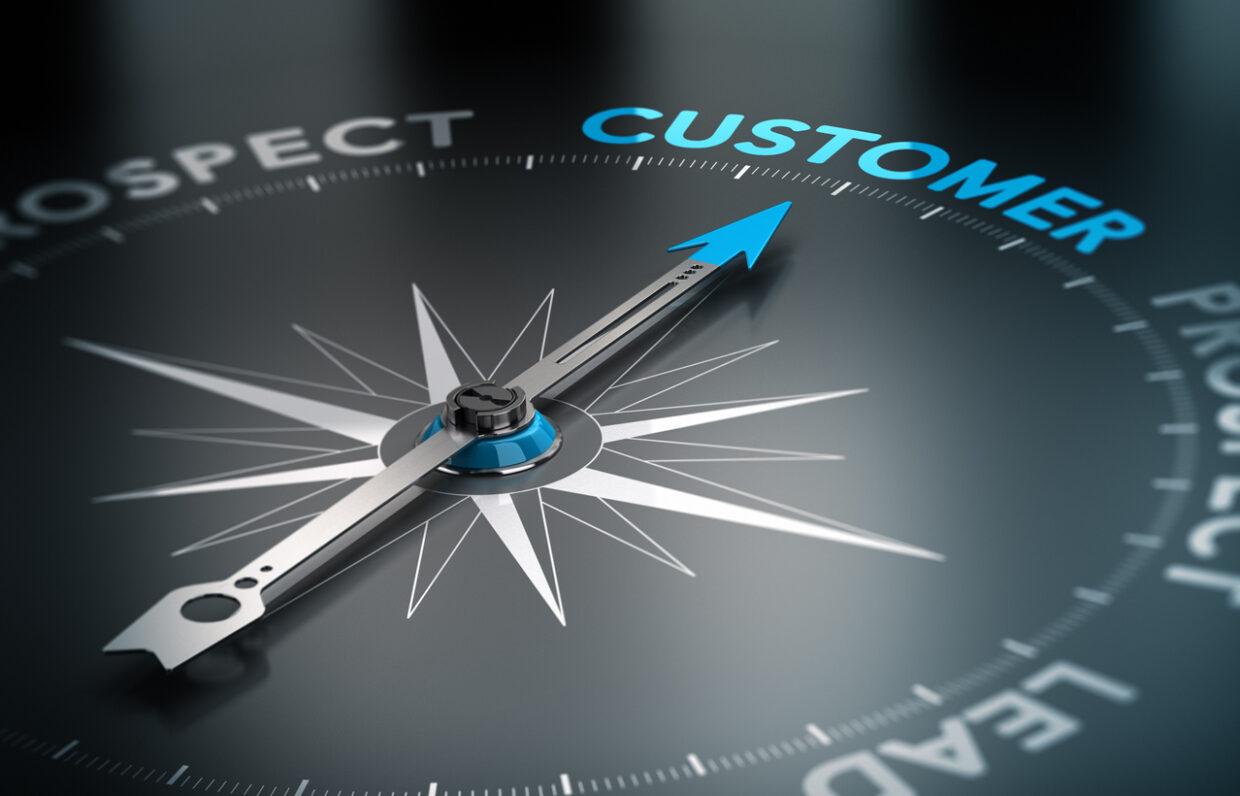 Conceptual 3D render image with depth of field blur effect. Compass with the needle pointing the word customer, Concept of crm and lead conversion.