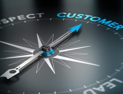 Conceptual 3D render image with depth of field blur effect. Compass with the needle pointing the word customer, Concept of crm and lead conversion.