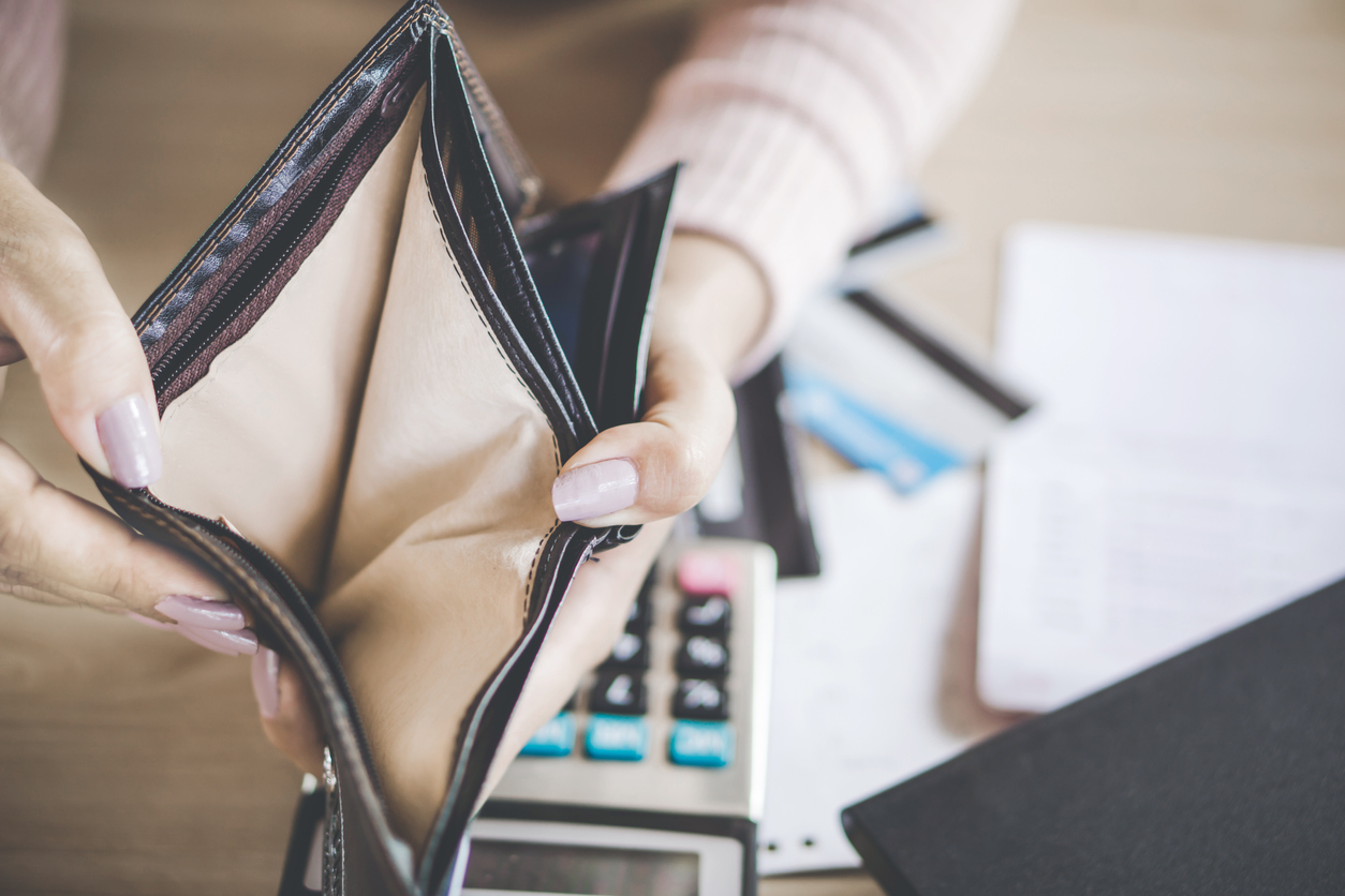 poor Asian woman hand open empty purse looking for money for debt